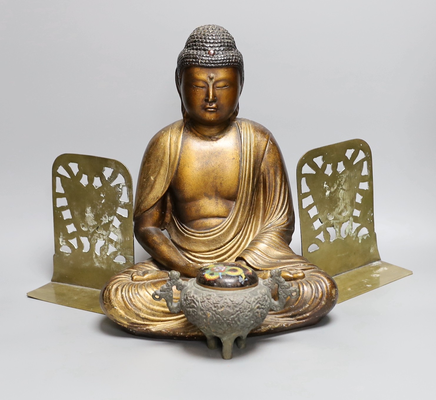 Assorted Chinese items, to include a bronze tripod censer, an enamel dragon cover, a lacquered seated Buddha, 34cm tall, and book ends (5)